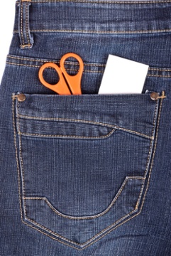 used_clothing_-_jeans_and_scissors